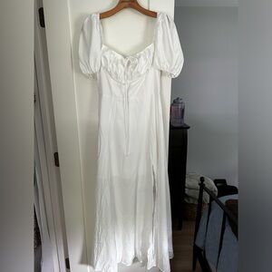 White off the shoulder zip up dress with slit in the leg